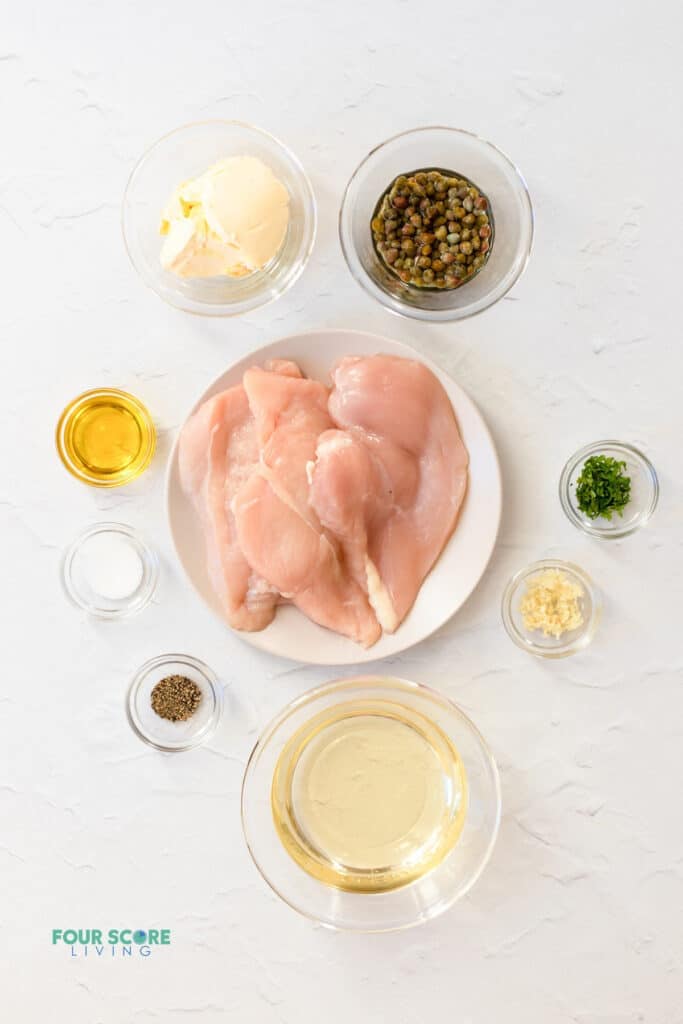 Top view photo of all the ingredients to make Chicken Paillard, in separate bowls.