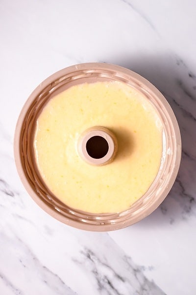 Top view photo of Italian Hangover Cake batter in a prepared Bundt cake pan, ready to bake.