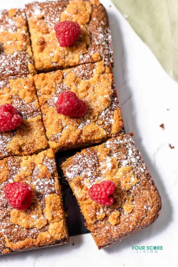 pieces of keto coffee cake, topped with a raspberry