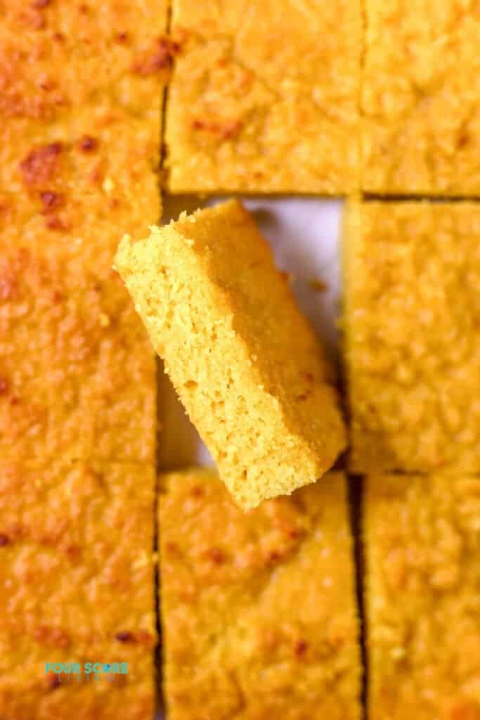 a slice of keto cornbread turned on its side to show the texture