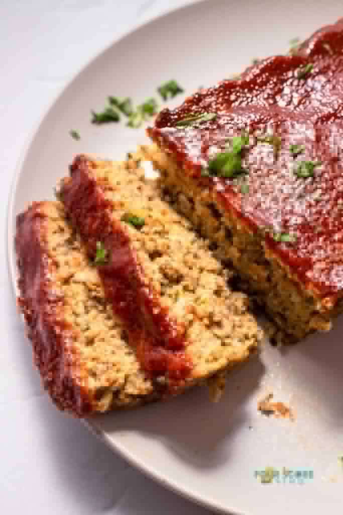 keto meatloaf sliced on a white plate