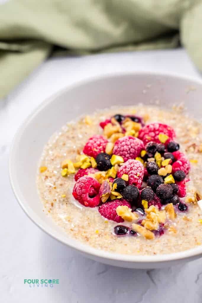 close up of keto oatmeal in a white bowl