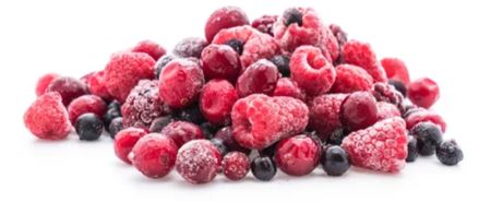 frozen strawberries, blueberries and raspberries in a pile on a white countertop