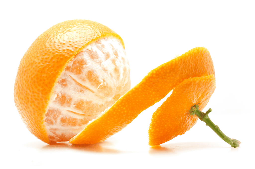 Single clementine with green stem and curled peel partially removed. 