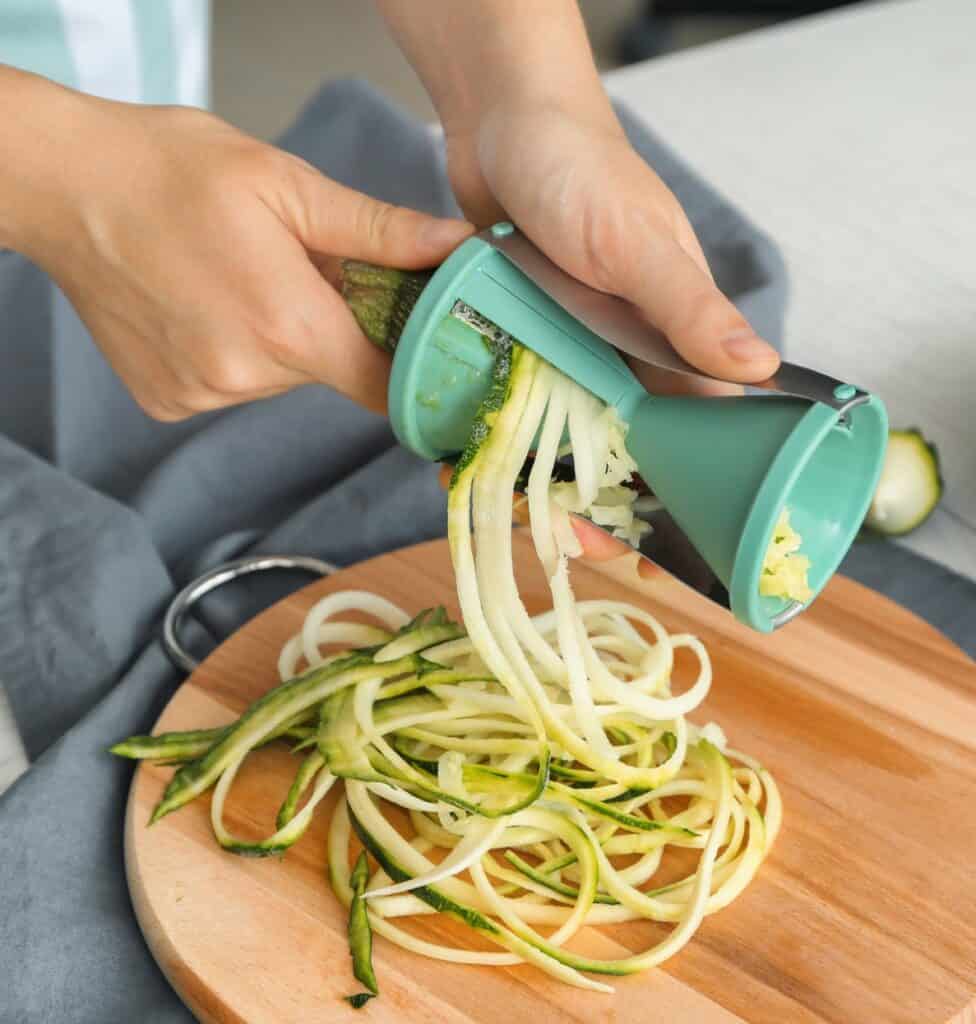 Handheld spiralizer making zucchini noodles