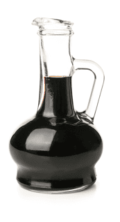Front view of clear glass bottle with handle filled with soy sauce. 